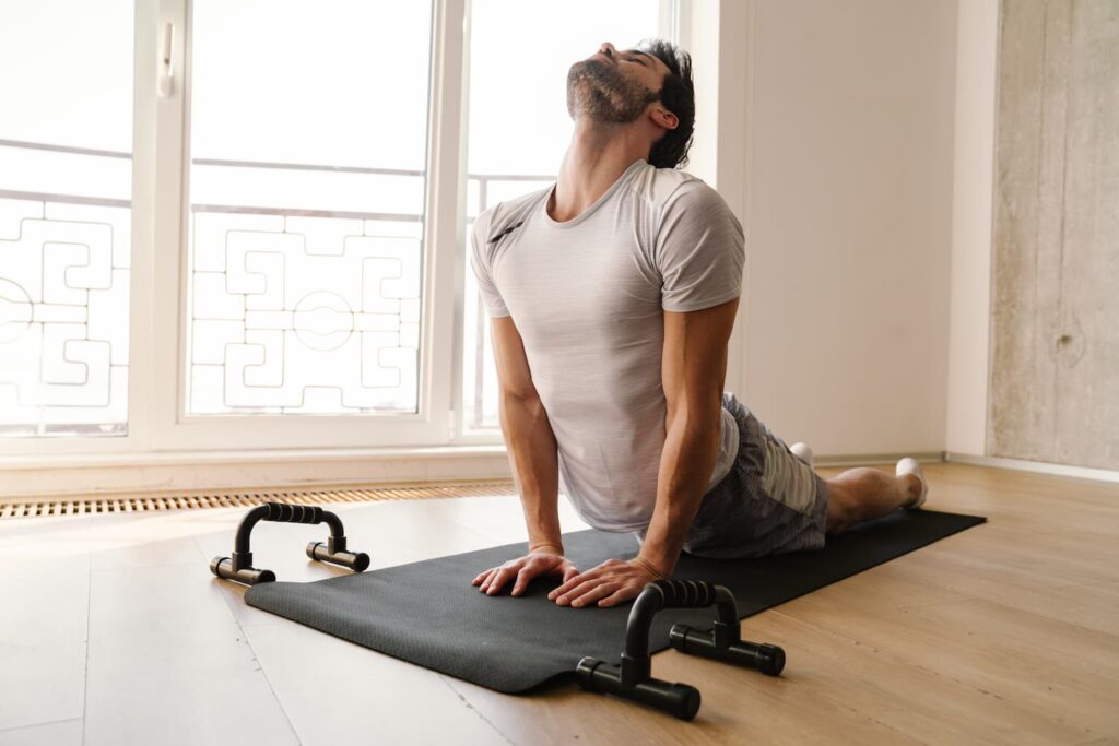 focused athletic man stretching his body while wor 2022 02 01 22 38 05 utc