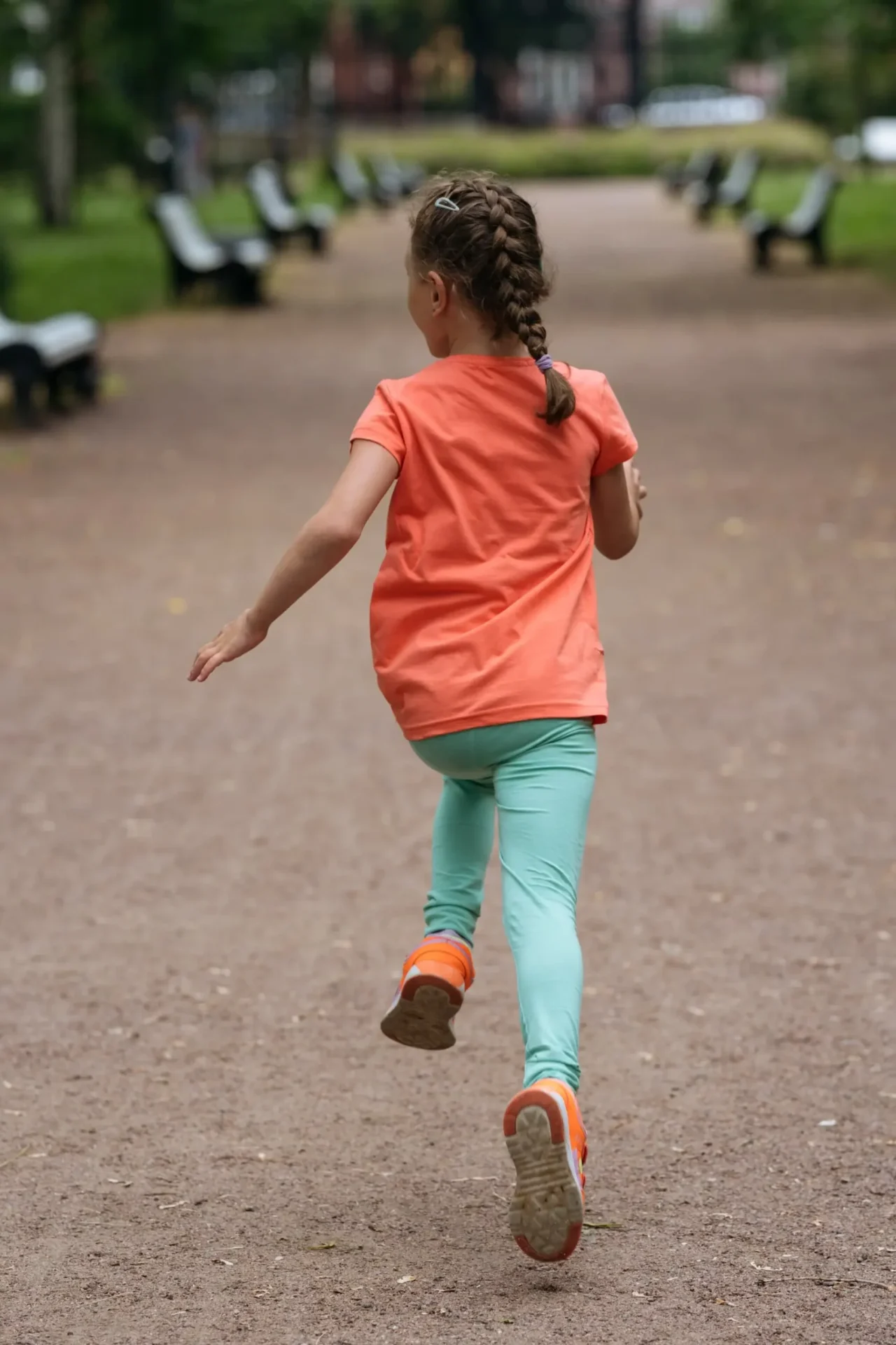 young girl running playfully on a dirt path in a p 2024 02 12 14 10 55 utc scaled 1