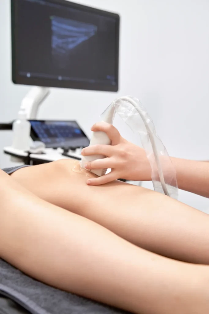 doctor doing an ultrasound scan while examining a 2024 12 05 14 17 19 utc